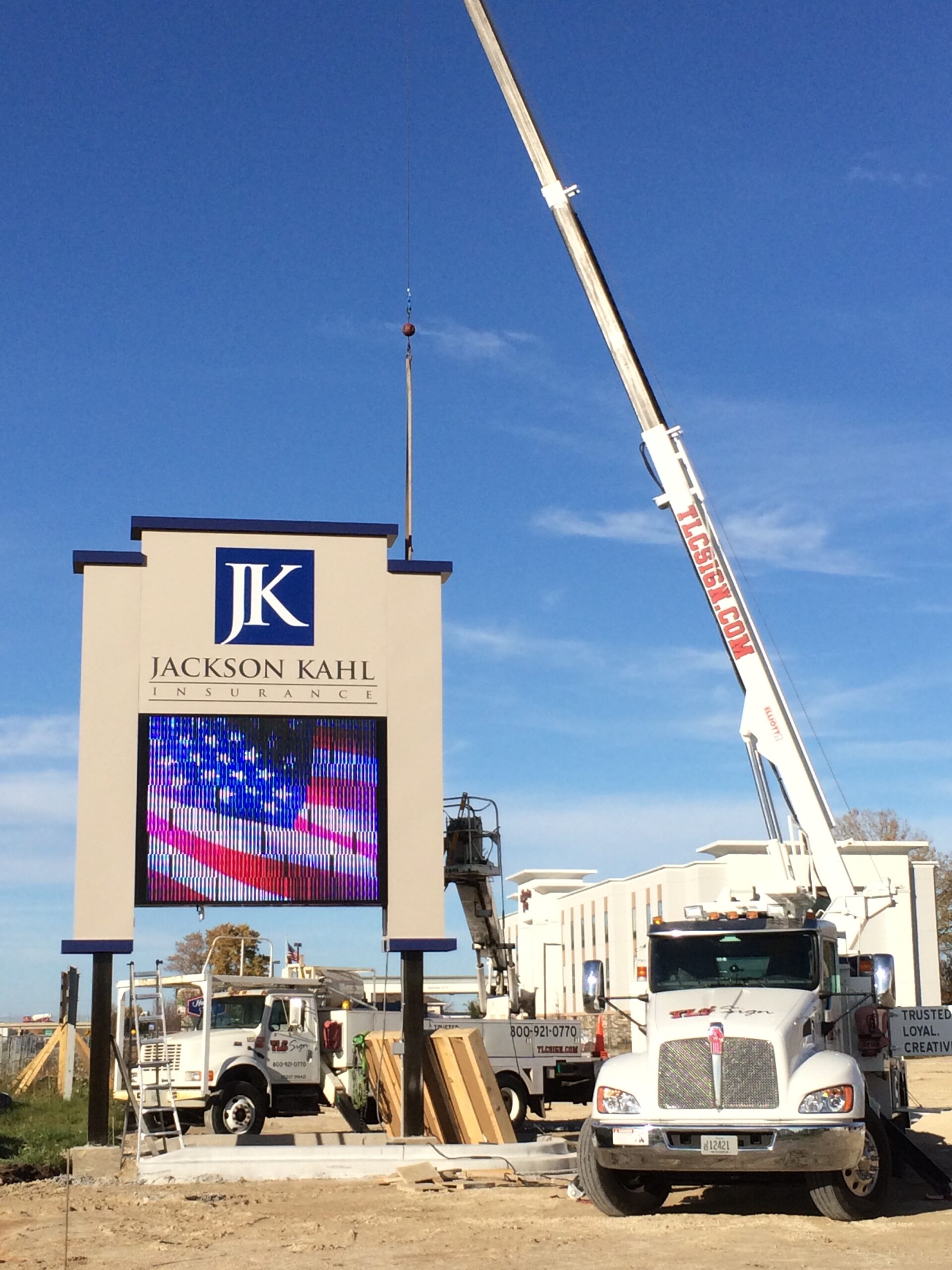 outdoor sign installation using a crane